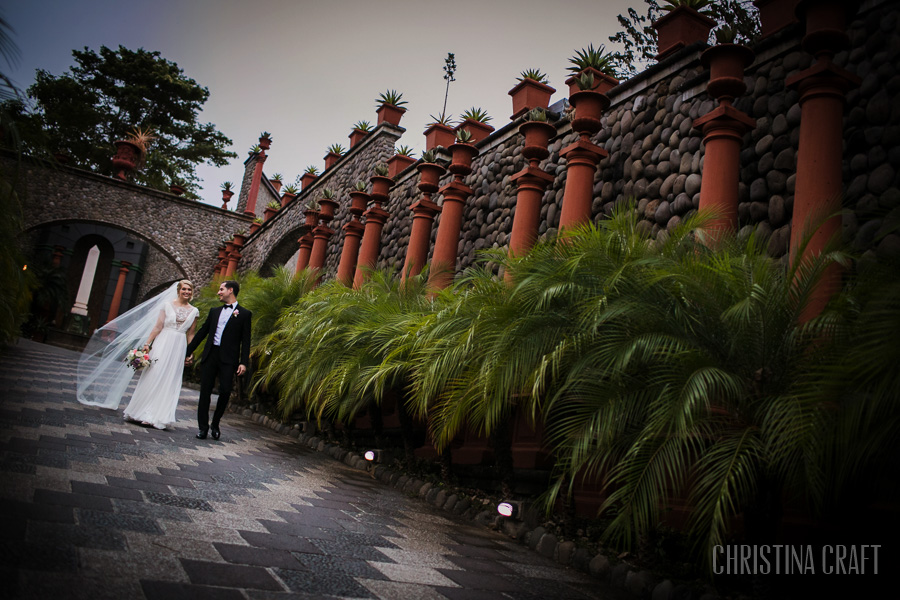 This is a wedding portrait of a couple walking down Zephyr Palace lane