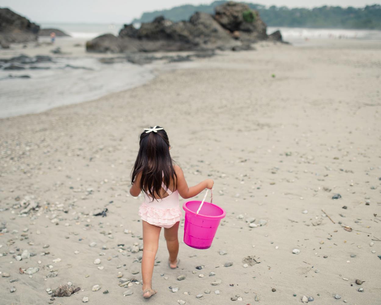 Family portraits on beach pink three years old