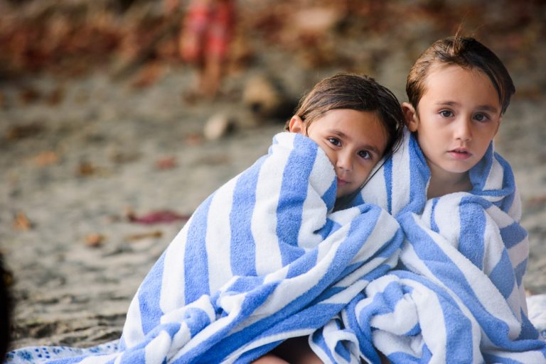 Family portraits at the beach candid documentary photographer