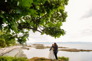 Neck Point Park wedding portraits of a bride and groom overlooking the ocean.