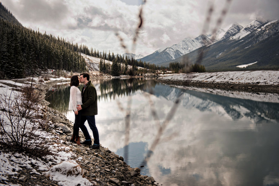 Portraits in winter and snow near Canmore Alberta at Spray Lakes Kananaskis and Quarry Lake Park. Engagement session photos by professional Canmore wedding photographer.